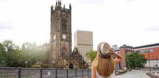 Beautiful Blonde Girl With Hat Walking In Manchester City