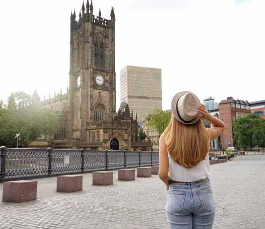 Beautiful Blonde Girl With Hat Walking In Manchester City