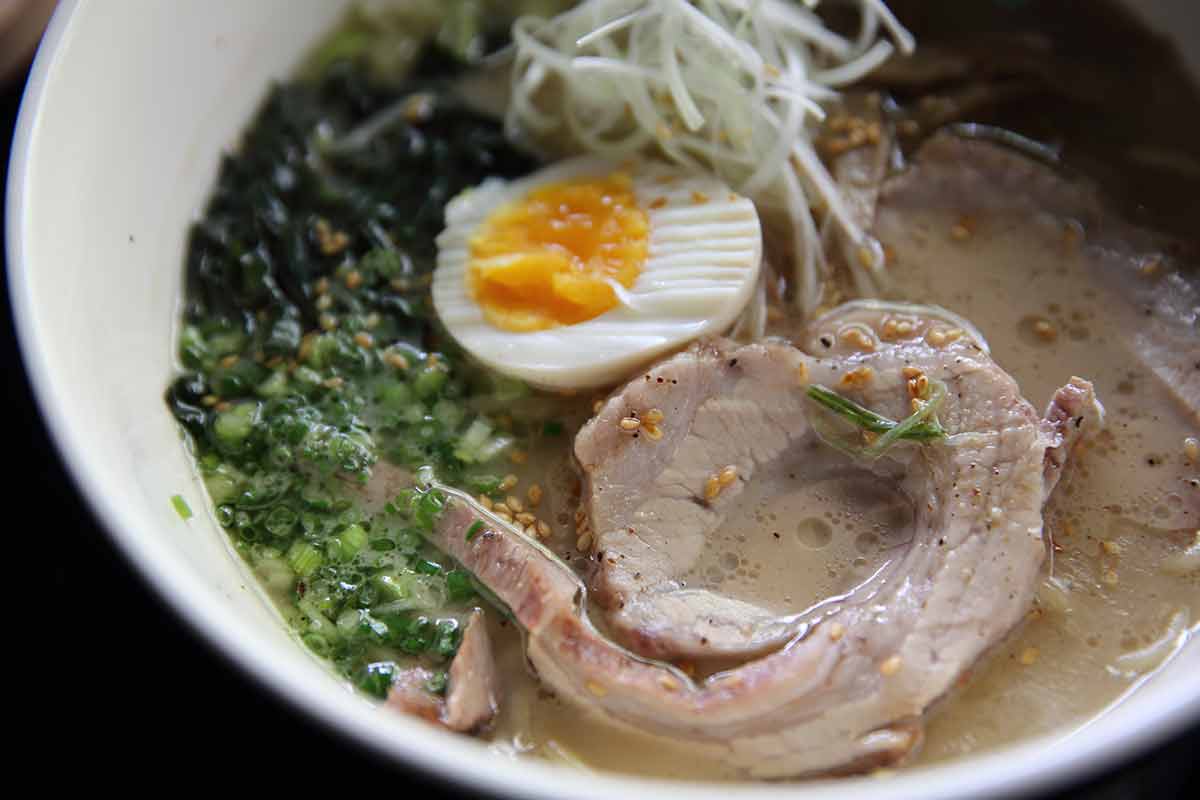 fukuoka japan things to do in june egg, pork and broth in a bowl