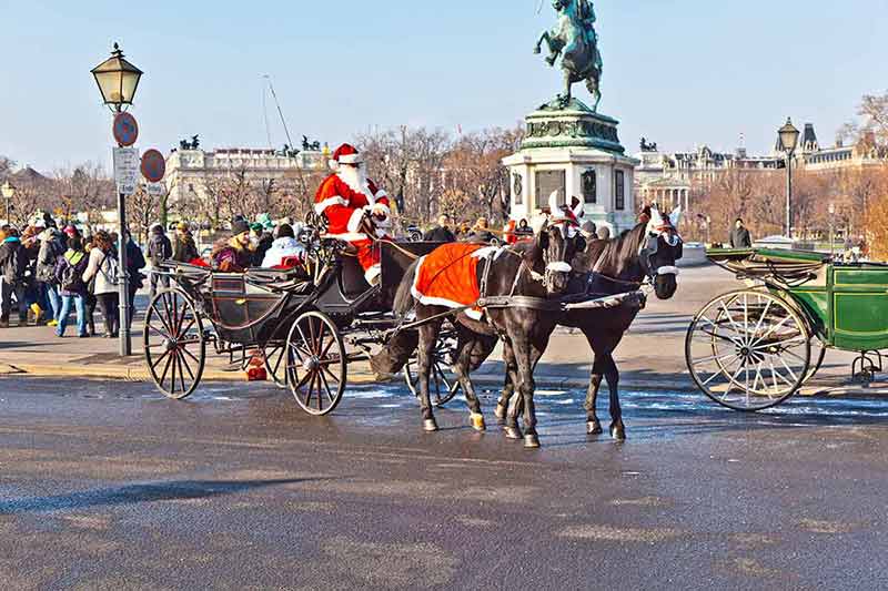 fun Christmas in Vienna buggy driver dressed as Santa Claus in red