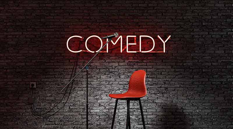 fun things to do at night in denver red neon lamp with the word COMEDY