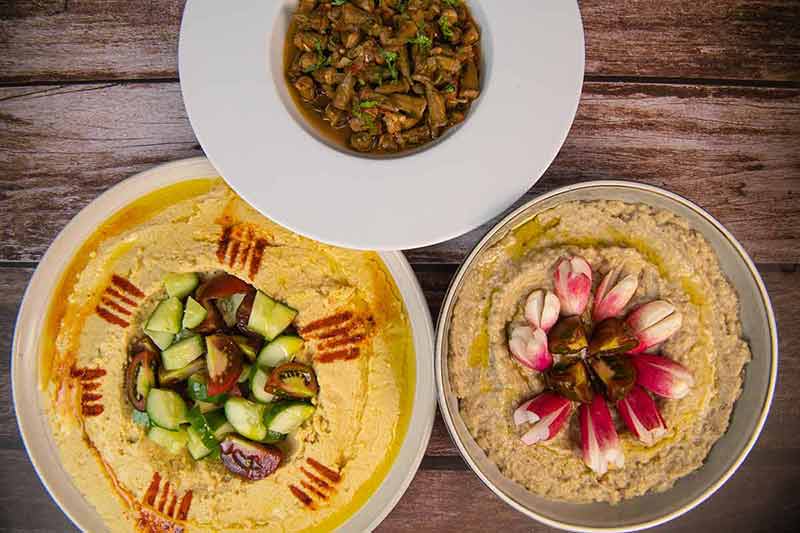 Lebanese Meze, Hummus, Aubergine Caviar And Okra In Tomato Sauce