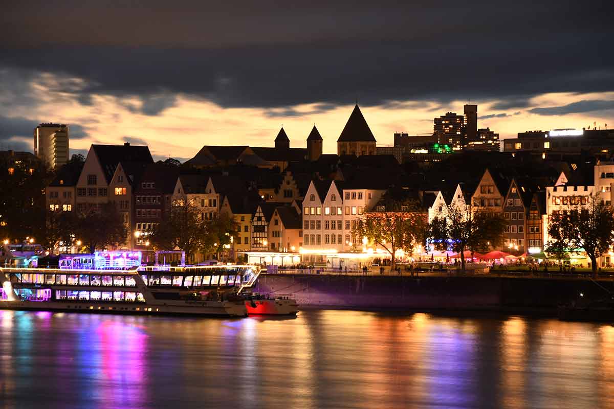 Colourfully Illuminated Cologne Old Town And The Banks Of The Rhine