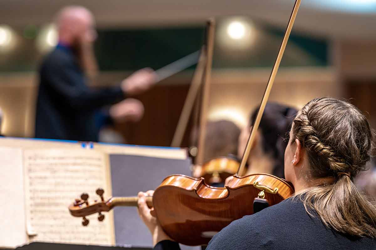 fun things to do in huntsville violinist plays at a concert in the Philharmonic.