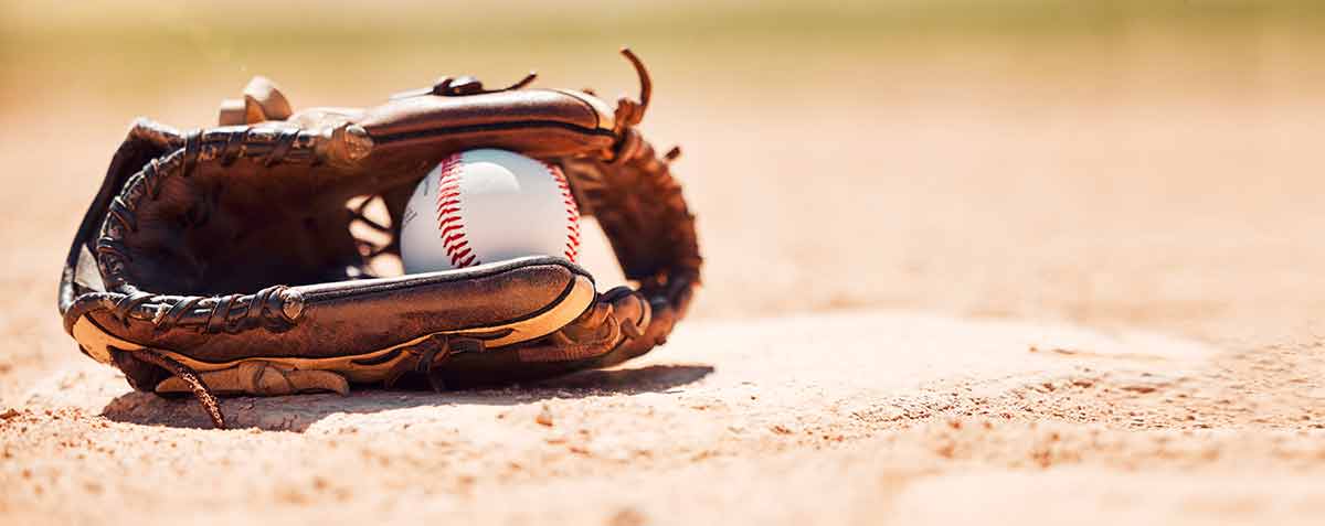 fun things to do in lansing Baseball field, softball and ball, glove and base plate on pitch ground, field and turf outdoors for competition, game or match.