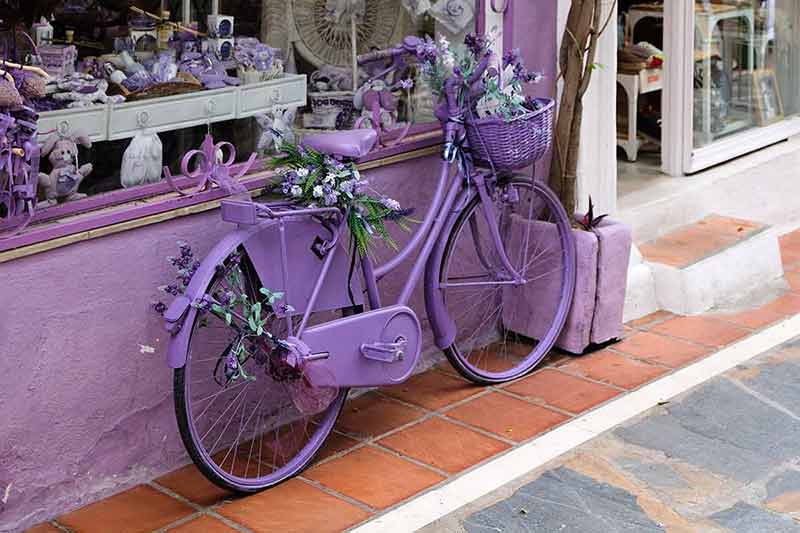 Lavender bicycle outside a shop in Marbella