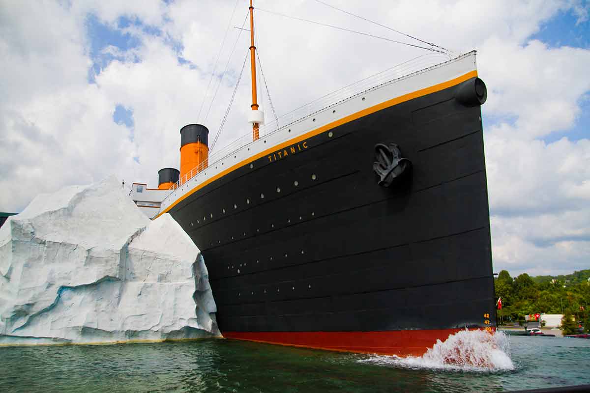 A Replica Of The Titanic Crashing Against A Large Iceberg