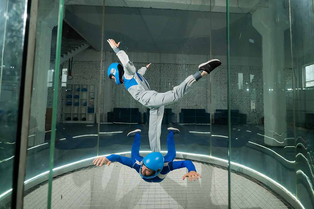 A Man And A Woman Enjoy Flying Together In A Wind Tunnel