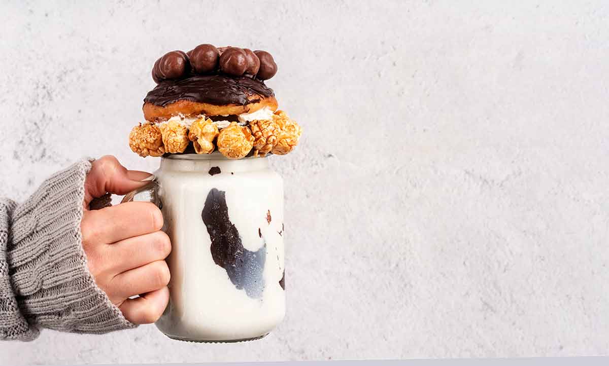 fun things to do in stamford ct milkshake in a mug piled high with popcord, donut and chocolate