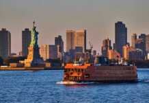 20 Best Things To Do In Staten Island Large Staten Island Ferry Passing By Statue of Liberty In Golden Hour