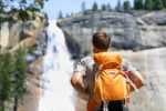 20 Things To Do In Yosemite National Park Before You Die fun things to do in yosemite national park portrait of male adult back standing outdoor.