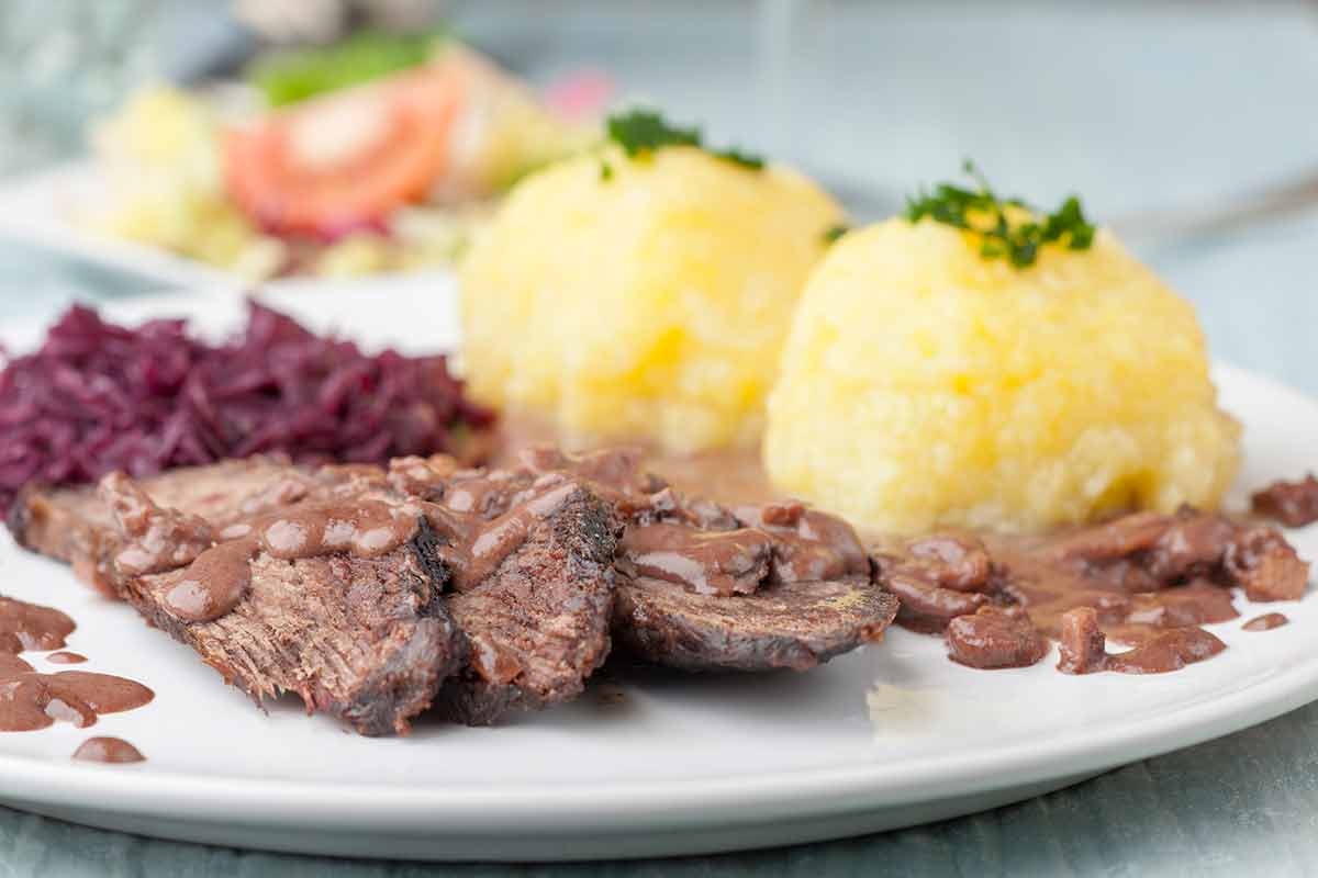 German Sauerbraten With Red Cabbage On A Plate