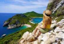 Female hiker girl enjoying natural landscape in Corfu Island, Greece.