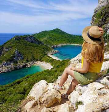 Female hiker girl enjoying natural landscape in Corfu Island, Greece.