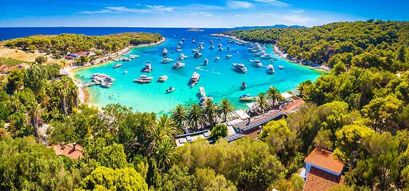 hvar croatia beaches Aerial panoramic view of Palmizana, summer leisure sailing cove and turquoise beach