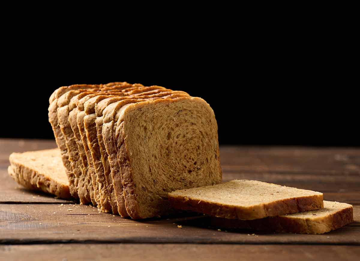 Sliced Wheat Flour Bread On A Wooden Board