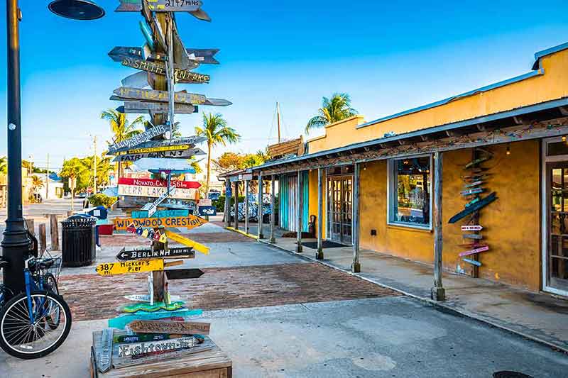 islands of the florida keys Key West distance marker and colorful street view, Florida Keys