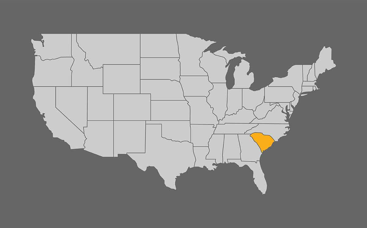 Map of the United States with South Carolina highlighted on grey background.