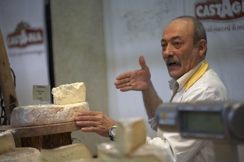 A cheesemaker at Salone del Gusto