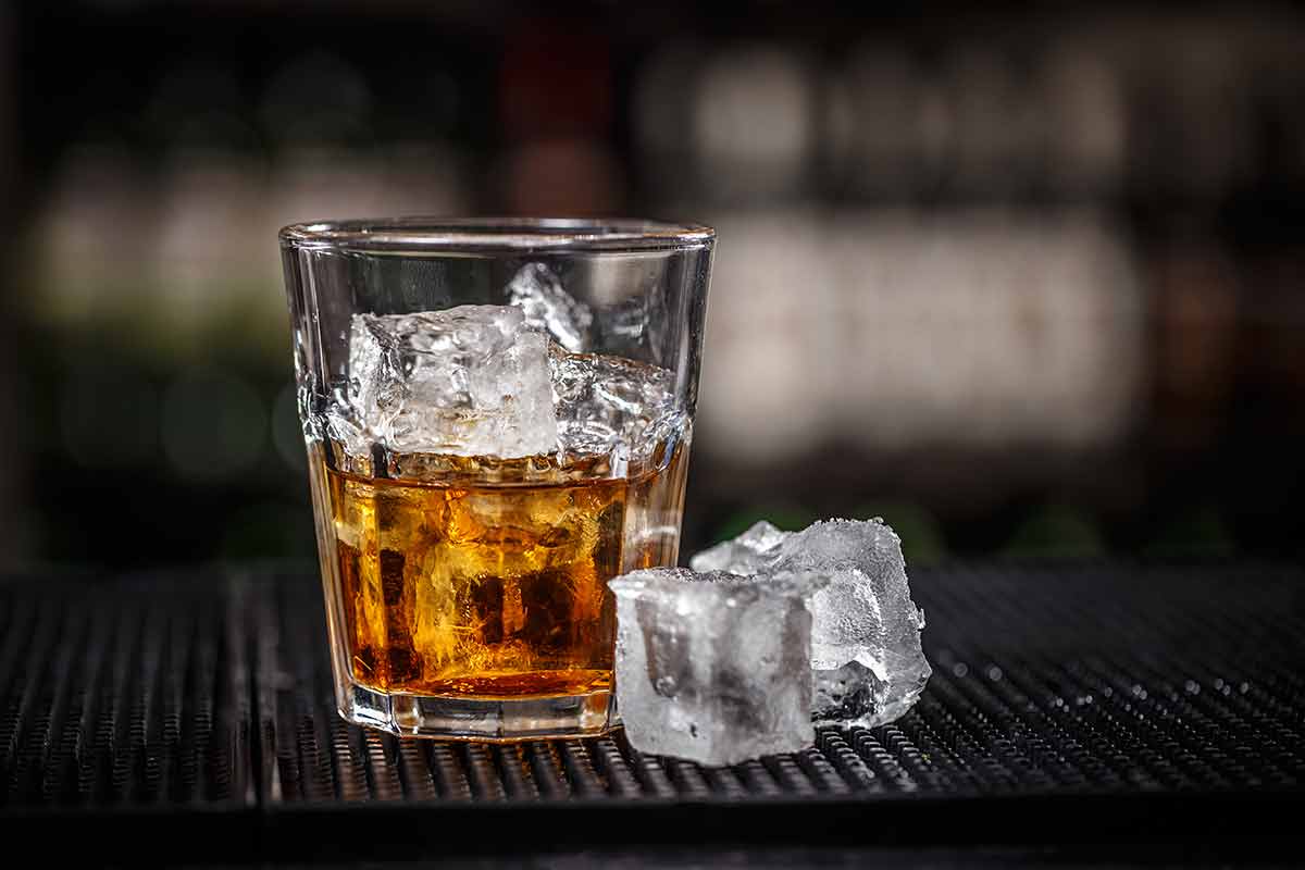 japanese alcoholic drinks whiskey with ice cube on bar counter