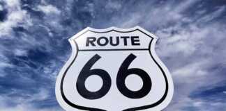 la to chicago drive An old, nostalgic route 66 sign and sky.