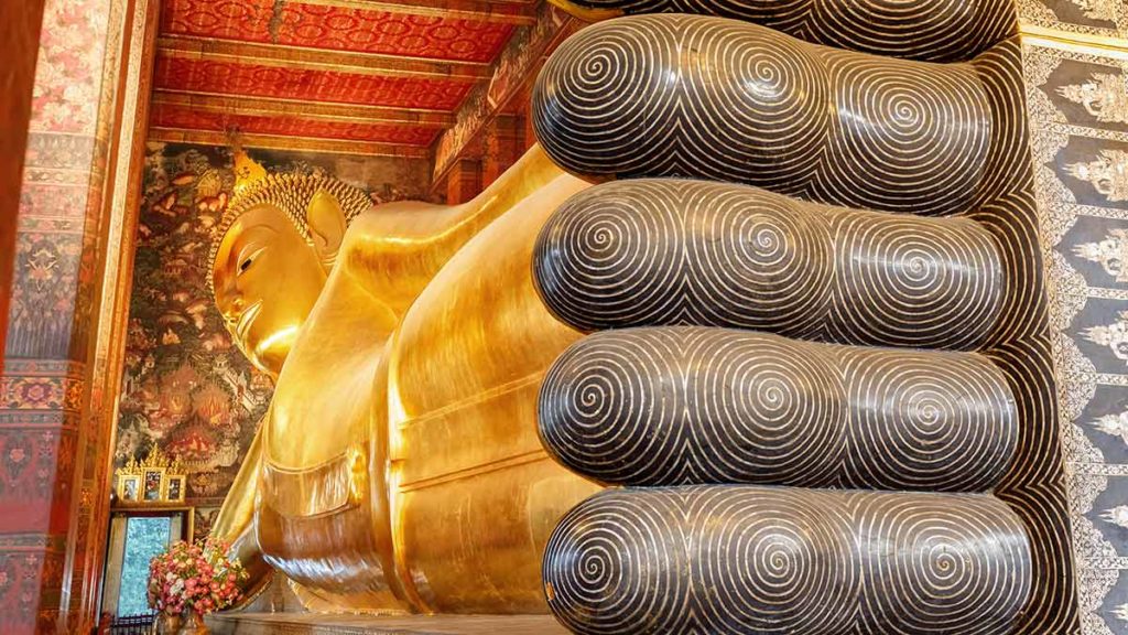 the giant Buddha at wat pho is one of the more impressive landmarks in thailand 