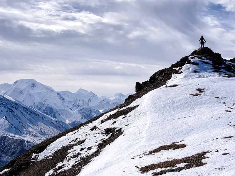 landmarks of alaska Mt. Mckinley climber at the summit