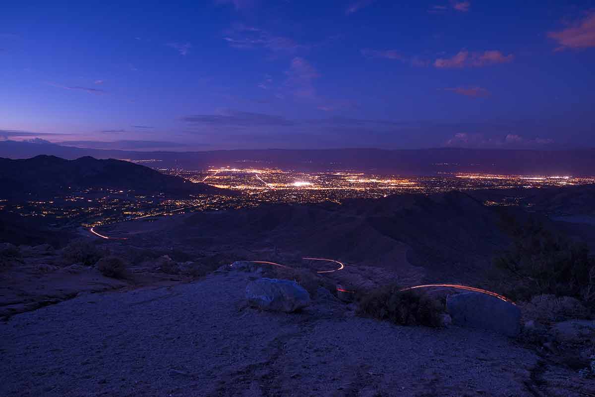 Scenic Coachella Valley with lights of Palm Springs at night