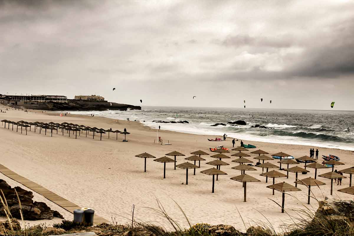 lisbon portugal beaches guincho beach tows of beach umbrellas