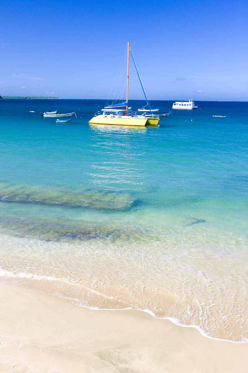 list of beaches in trinidad and tobago catamaran moored near the beach