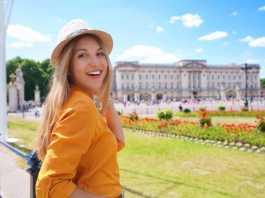 london in the spring Portrait of young tourist woman visiting London, United Kingdom. Looking at camera.