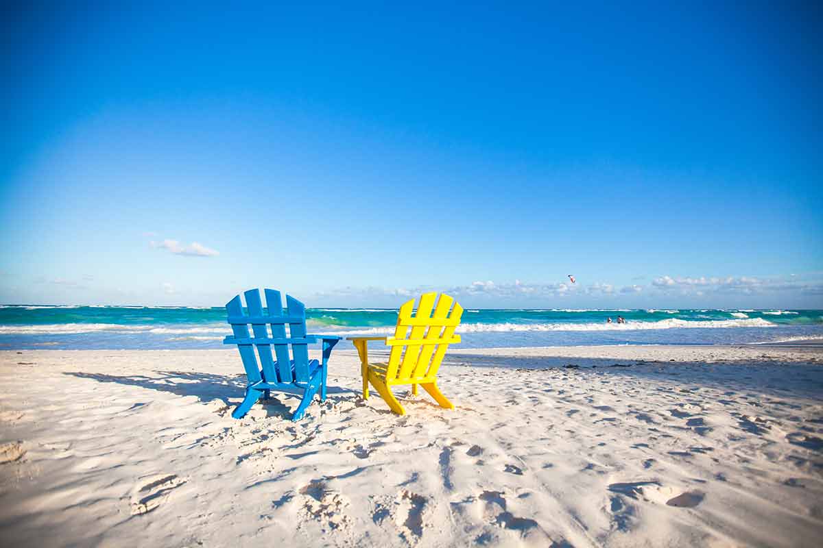 longest beaches in the world list colourful chairs on the beach
