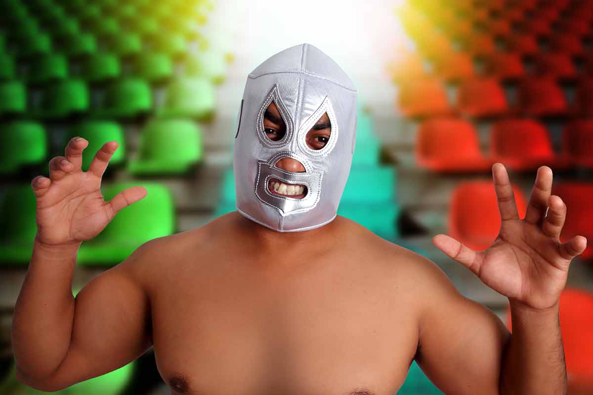 lucha libre mexico man wearing a silve mask in a stadium