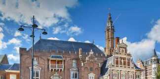 20 Beautiful Cities In The Netherlands You Should Visit At Least Once Haarlem City Hall on a blue sky day