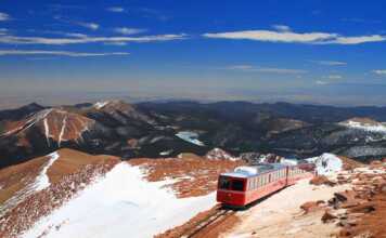 20 things to do in Manitou Springs that feel totally unique manitou springs pikes peak train with sprinkling of snow