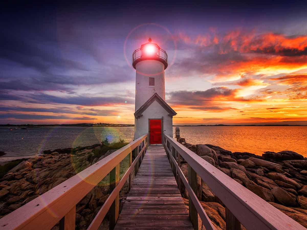 massachusetts state beaches Annisquam lighthouse at sunset off the coast of Gloucester