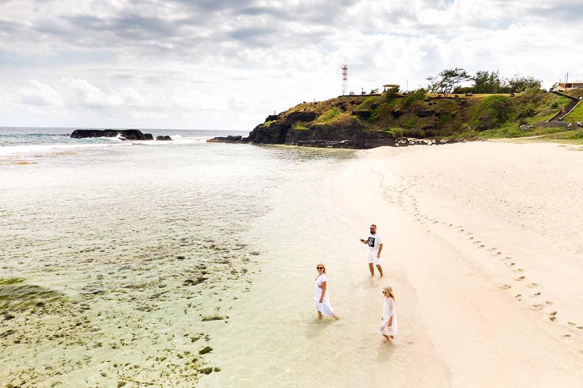 mauritius beaches photos a family walks on Gris Gris beach