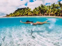 mauritius beaches woman in white bikini underwater