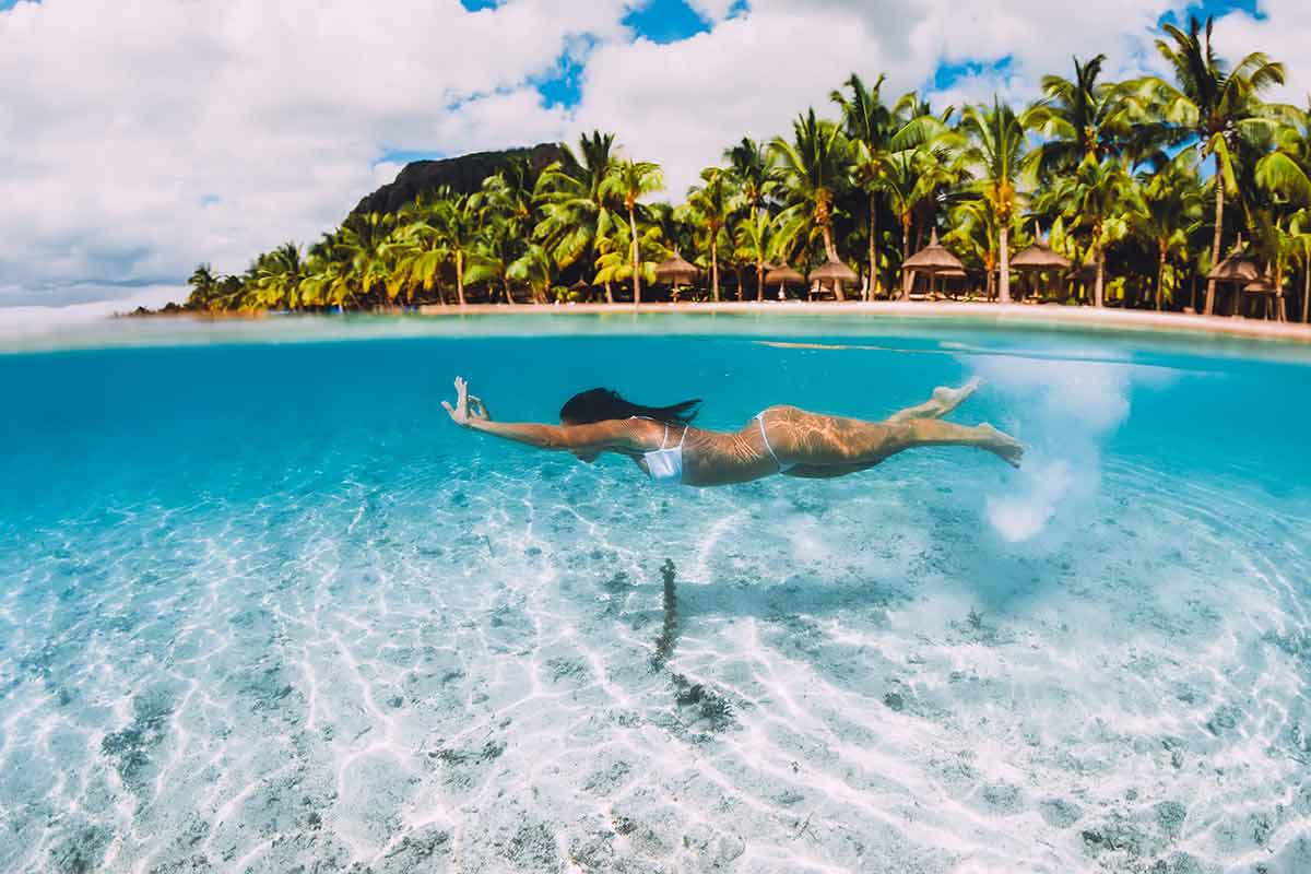 mauritius beaches woman in white bikini underwater