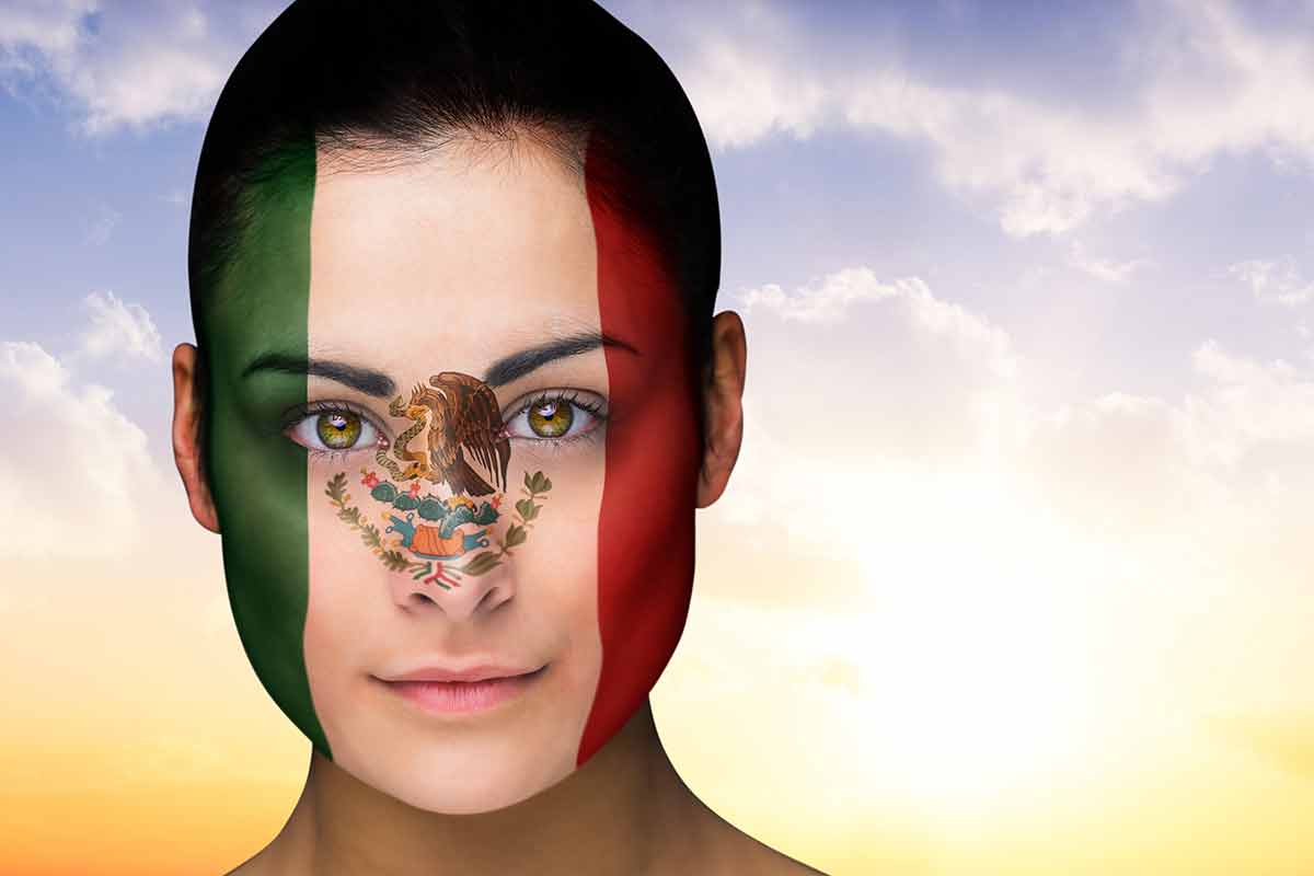 mexican culture traditions woman with Mexico flag painted on her face