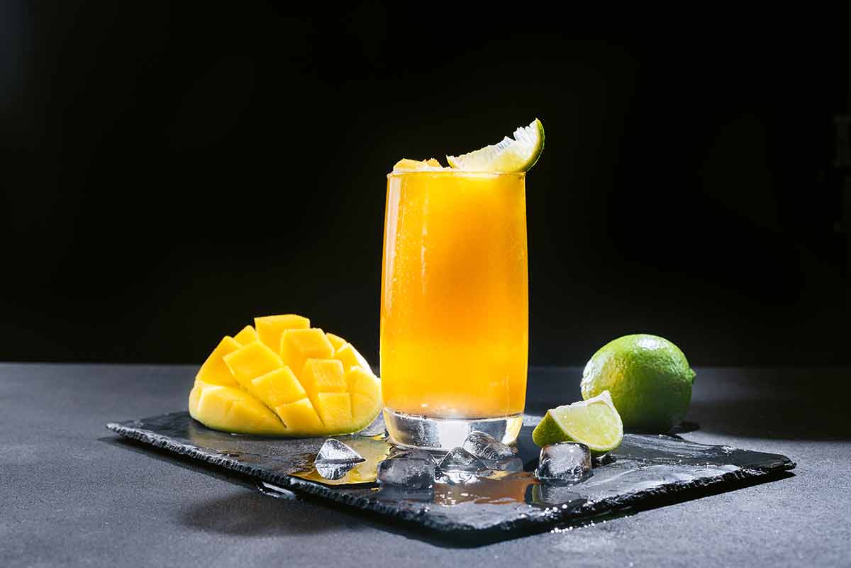 mexican drinks non alcoholic list A refreshing summer smoothie on a black background of bright orange
