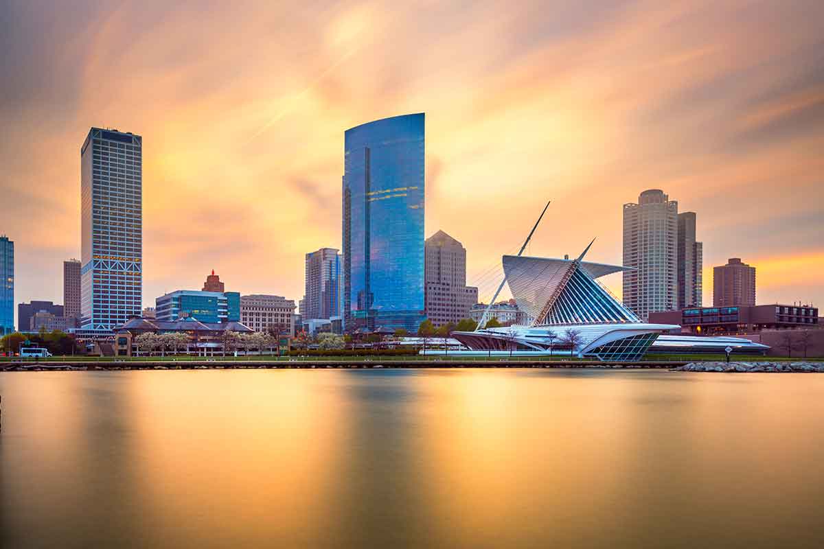 Milwaukee skyline across the river at dusk