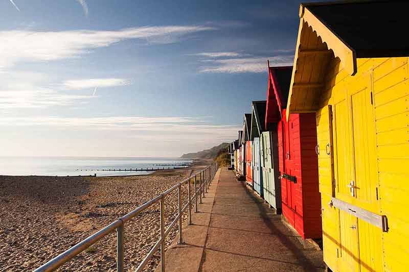 Photo of colourful beach huts on one of the most beautiful beaches in england