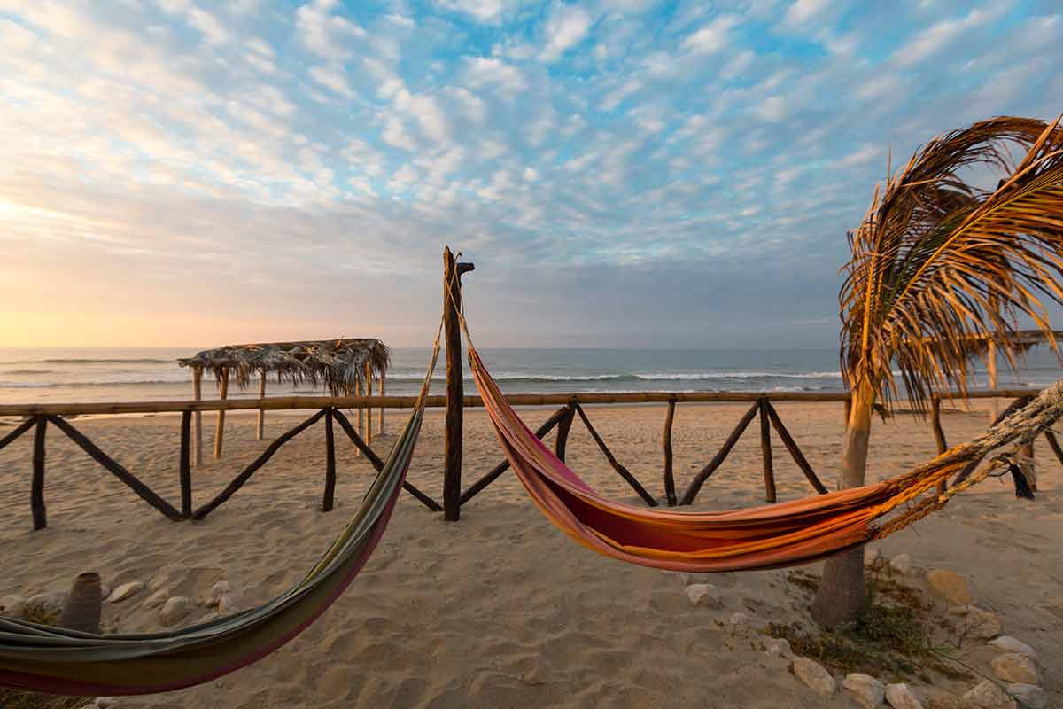 most beautiful beaches in peru punta sal hammocks strung between poles