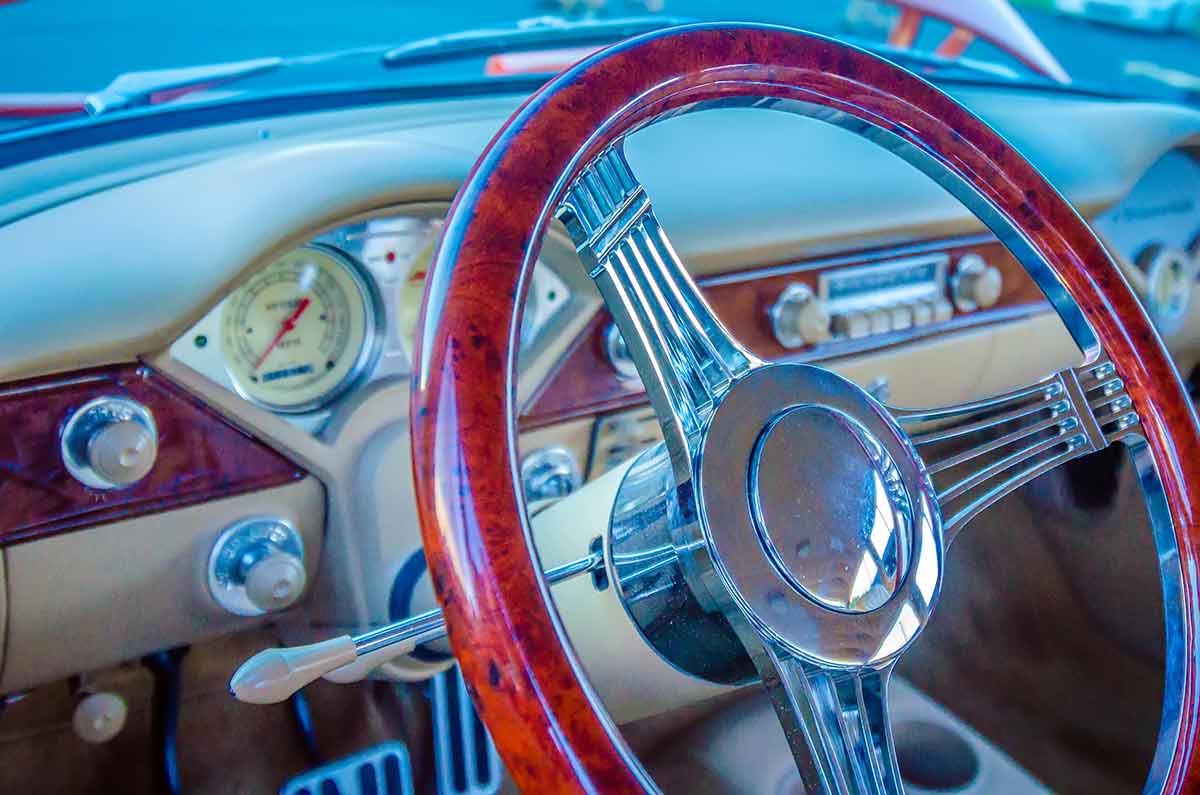 the steering wheel of a classic car