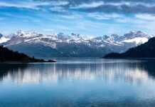 20 National Parks In Alaska That Feel Unreal national parks in anchorage alaska snow-capped mountains reflected in the wter