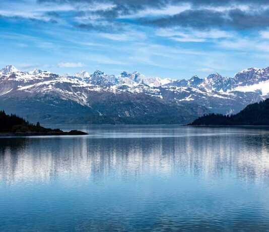 national parks in anchorage alaska snow-capped mountains reflected in the wter