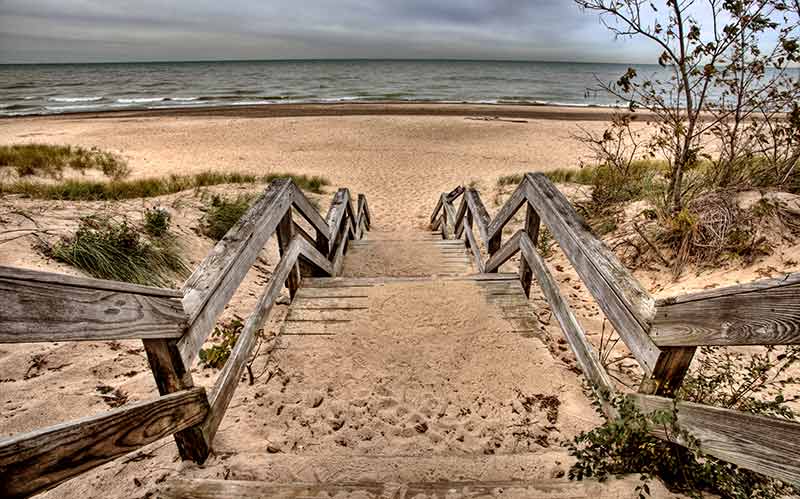 national parks in indiana timber staircase leading onto the sand