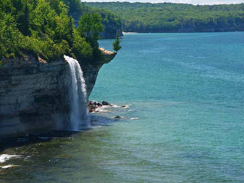 national parks in michigan waterfall plunging into the ocean