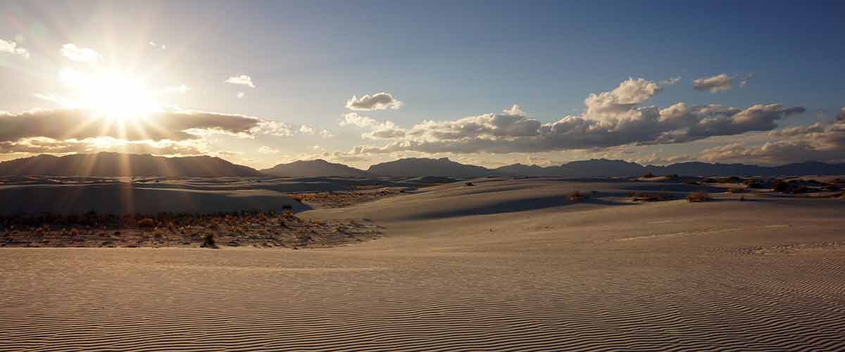 national parks in new mexico list sun shining on the vast sand